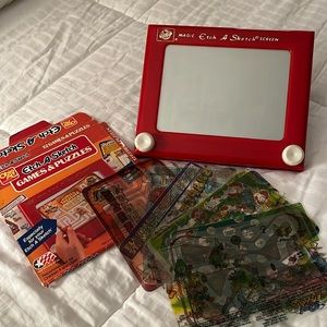 Vintage Etch A Sketch by Ohio Art with 12 games and puzzle sheets.